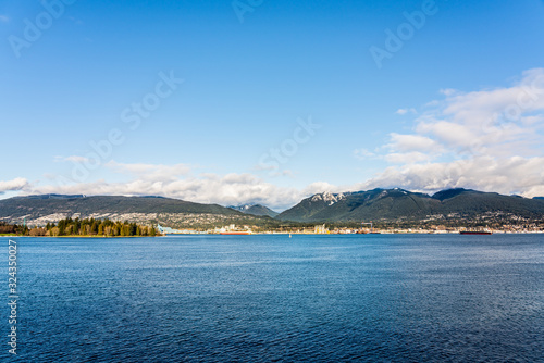 Fototapeta Naklejka Na Ścianę i Meble -  Vancouver, British Columbia, Canada - December, 2019 - Mountain View with clouds in a Beautiful blue sky day.