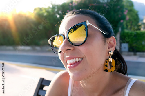 smiling girl with dental diamond piercing