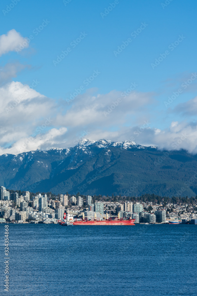 Vancouver, British Columbia, Canada - December, 2019 - Mountain View with clouds in a Beautiful blue sky day.