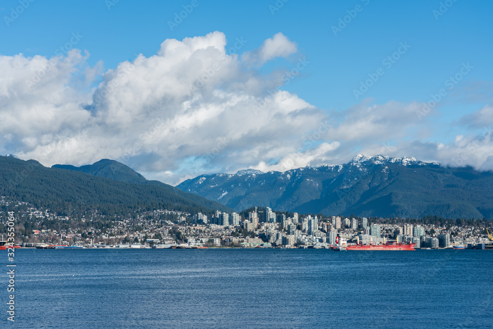 Vancouver, British Columbia, Canada - December, 2019 - Mountain View with clouds in a Beautiful blue sky day.