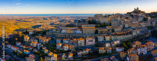 Beautiful aerial scenic view of Guaita fortress on Monte Titano with San Marino city in background at sunrise. Beautiful country of San Marino historical center. Castle on top of the hill.