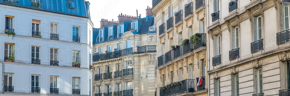 Paris, typical facade and windows, beautiful building in Montmartre