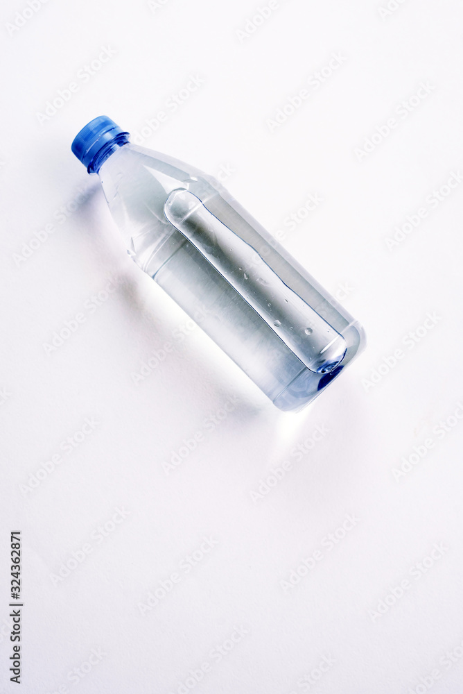 plastic bottle with a sparkle of water on a white background. Copyspace, place for text plastic bottle with a sparkle of water on a white background. Copyspace, place for text