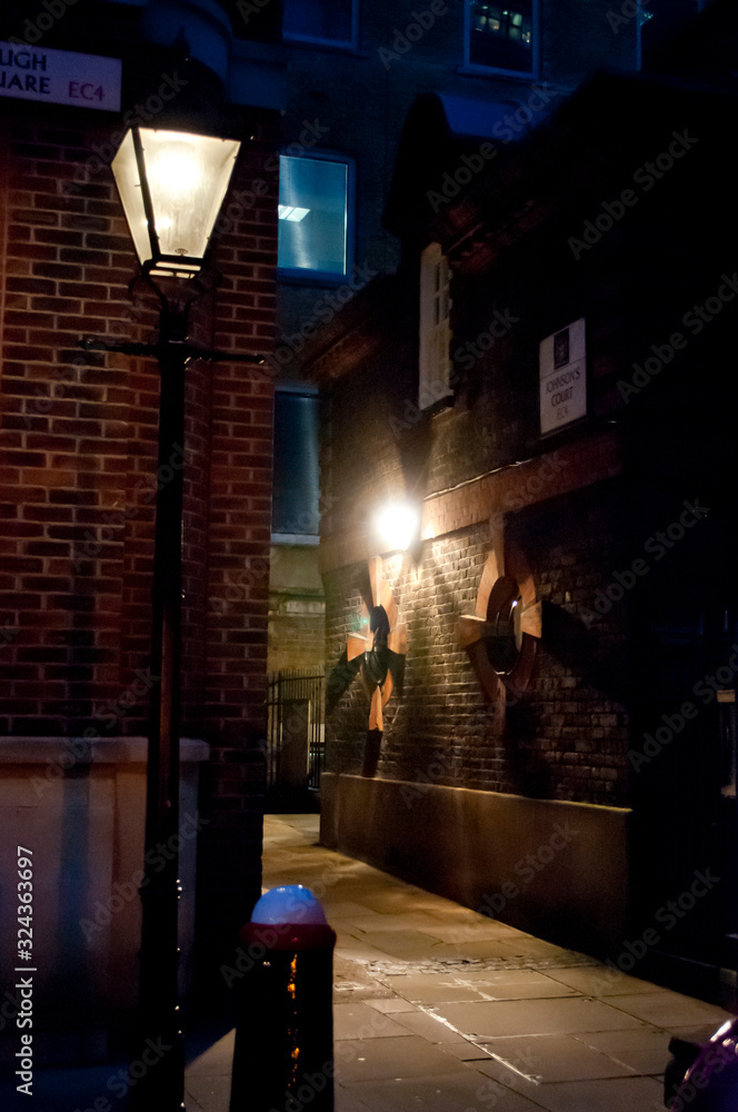 Narrow alley at night, City of London, EC4, UK
