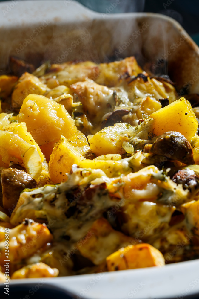 Baked potatoes with mushrooms and cheese with seasonings and herbs Baked potatoes with mushrooms and cheese with seasonings and herbs