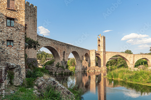 Romanesque defensive bridge over the Fluvia River in Besalu  Catalonia.
