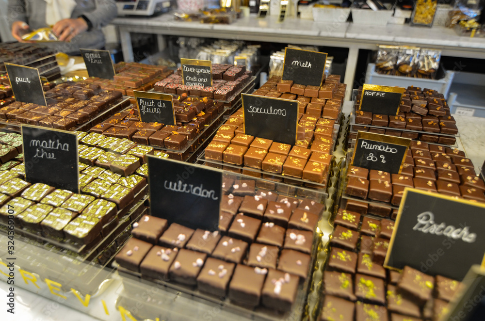Fototapeta premium Bruges, flanders belgium. August 2019. The chocolate of this city is a famous food specialty: in the windows you can see every good thing.