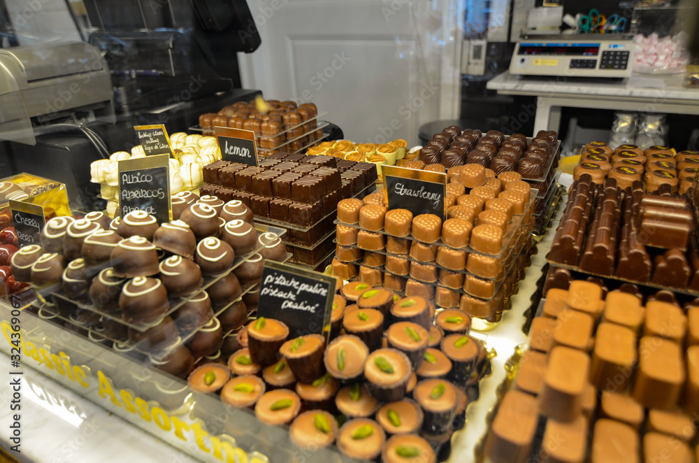 Bruges, flanders belgium. August 2019. The chocolate of this city is a famous food specialty: in the windows you can see every good thing.