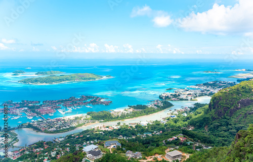 Aerial view of ciity Victoria with blue ocean, coastline and artificial islands. © 22Imagesstudio