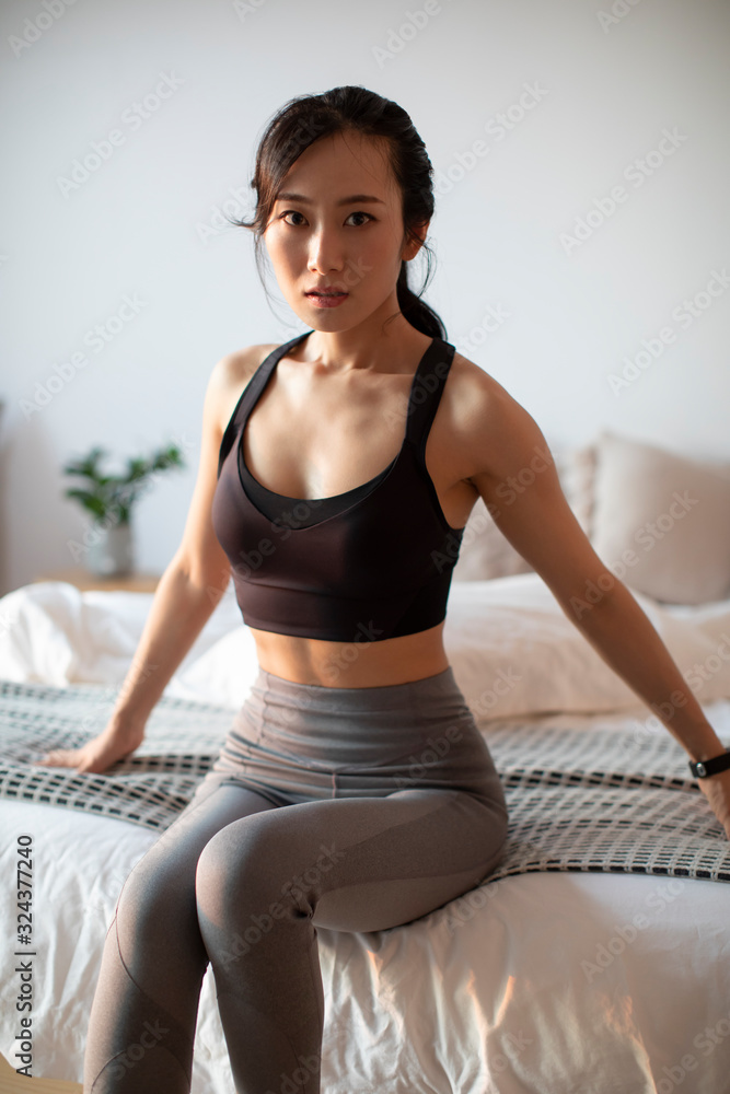 Young Chinese woman getting ready for morning exercise Young Chinese woman getting ready for morning exercise