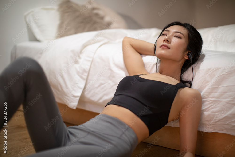 Young Chinese woman resting after workout Young Chinese woman resting after workout