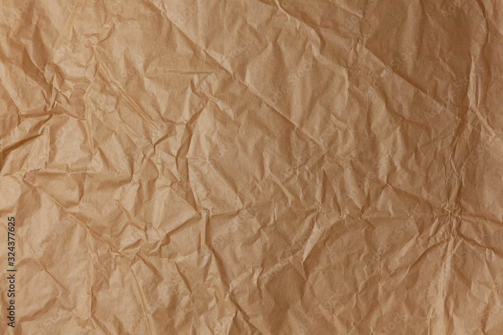 Abstract texture. Crumpled craft brown paper background. Copy space for text. Horizontal. DIY, handicraft, back to school, ecology, plastic free concept, harvesting for mock up. Flat lay, top view