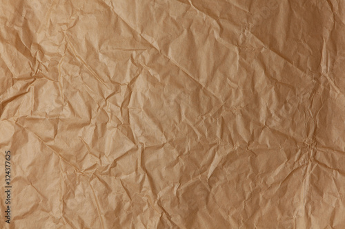 Abstract texture. Crumpled craft brown paper background. Copy space for text. Horizontal. DIY, handicraft, back to school, ecology, plastic free concept, harvesting for mock up. Flat lay, top view