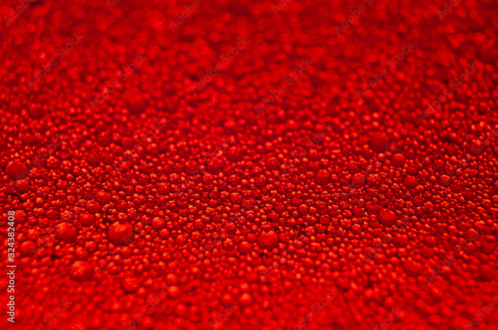 Water drops texture on red background Water drops texture on red background