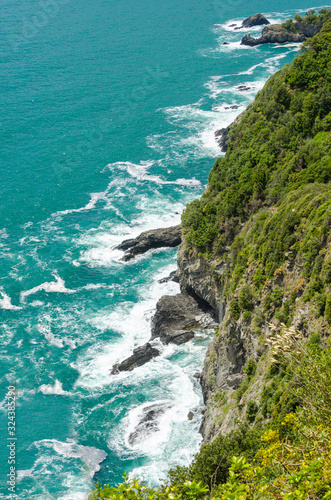 Majestic rocky and ocean view from famous trail between Monterosso and Vernazza, Italy.