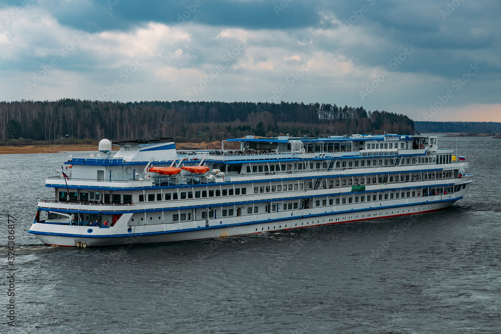 Cruise liner with tourists on the river Volga Cruise liner with tourists on the river Volga