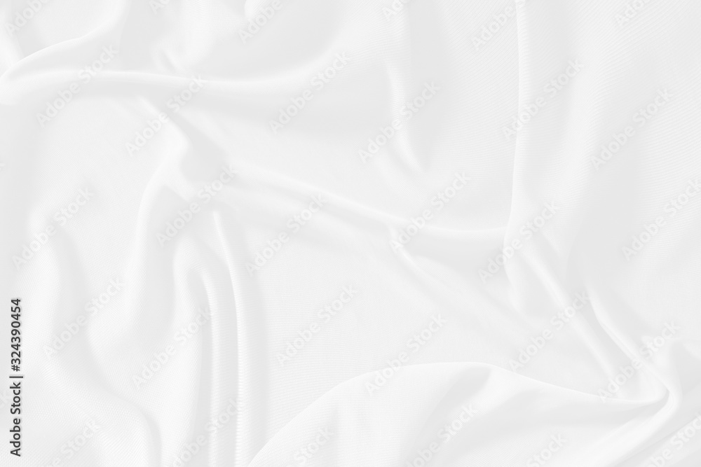 White cloth background abstract. Fabric is wrinkled and sofe wave. Material are used in textile assembly. detail texture of pattern design, elegance with free space copy for backdrop or wallpaper.