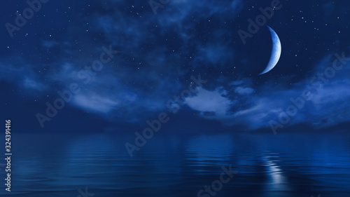 Half moon in starry night sky above ocean surface photo