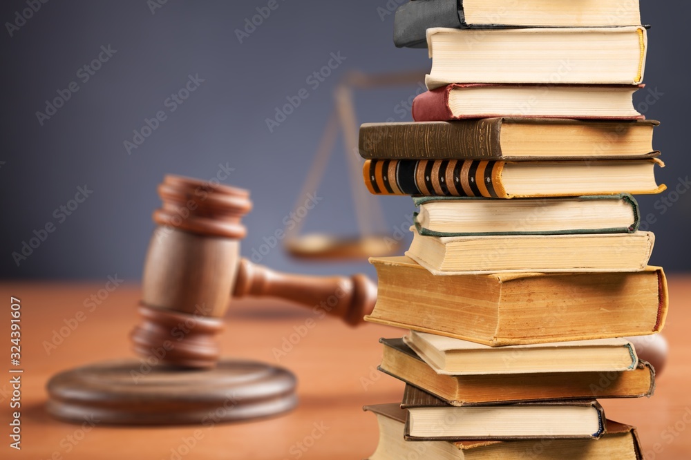 Collection stack of old retro books and justices gavel Collection stack of old retro books and justices gavel
