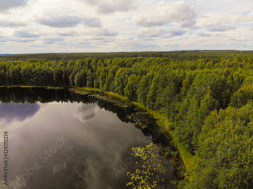 Fototapeta Naklejka Na Ścianę i Meble -  Aerial shooting of a magic lake in the taiga of Russia