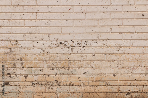 Concrete wall with brick pattern and texture