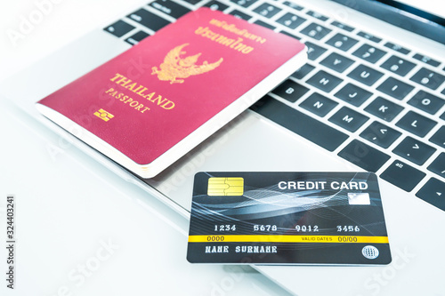 Credit card and passport on keyboard