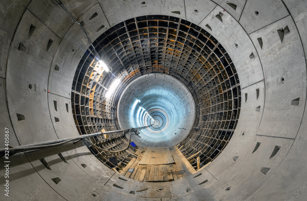 Construction of a new subway tunnel. Round tunnel with lighting Construction of a new subway tunnel. Round tunnel with lighting