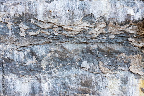 background. destruction of a stone wall