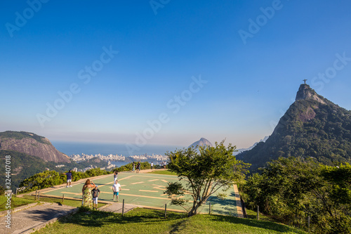 View from helicopter helipad on Mirante Dona Marta of Mount Corcovado with Christ the Redeemer  Cristo Redentor  in the background under a clear blue sky in Rio de Janeiro  Brazil  South America