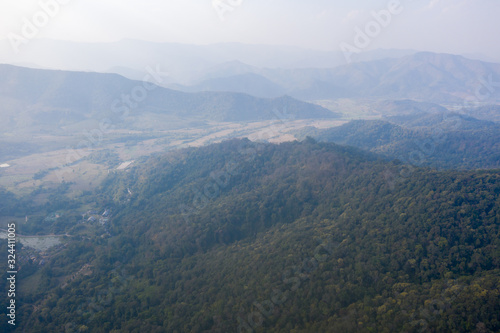 Aerial view of mountain against foggy sky