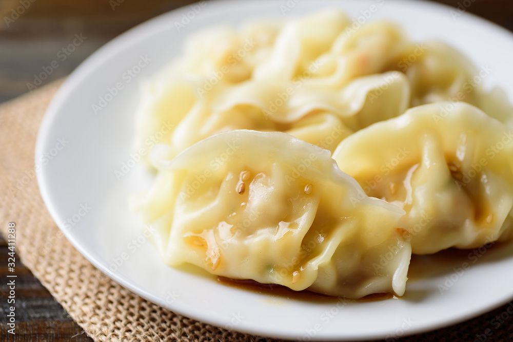 Steamed wonton dumpling stuffed with minced pork and shrimp, Asian cuisine Steamed wonton dumpling stuffed with minced pork and shrimp, Asian cuisine