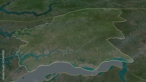 Oio, region with its capital, zoomed and extruded on the satellite map of Guinea Bissau in the conformal Stereographic projection. Animation 3D photo