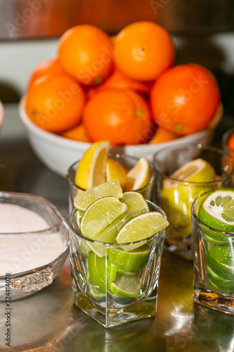 Slices of citrus behind the bar