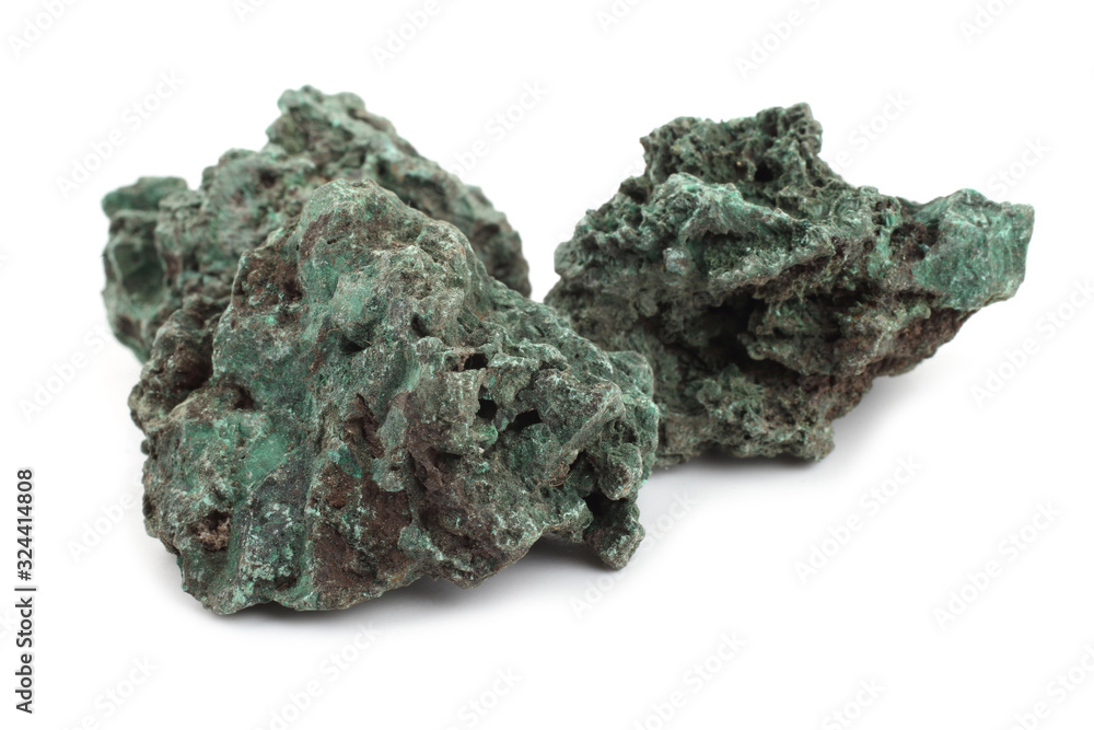 Raw malachite stones isolated on white. Cu2CO3(OH)2 Raw malachite stones isolated on white. Cu2CO3(OH)2