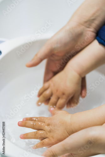 Asian mothers washing hands for infants