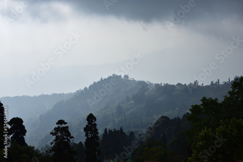 View From Mountains to the Valley Covered with Foggy. Foggy Landscape. photo