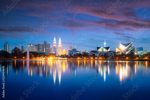Kuala Lumpur city skyscraper and fountation with nice sky twilight at Titiwangsa Park in Kuala Lumpur. Malaysia. Travel and Vacation concept.