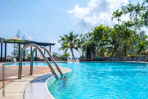 landscape swimming pool blue sky with clouds. Tropical beautiful hotel in thailand.