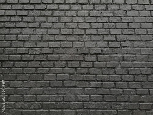 Black brick pattern texture wall. raw vintage clean background style.