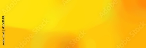 unfocused bokeh horizontal background with tangerine yellow, orange and gold colors space for text or image