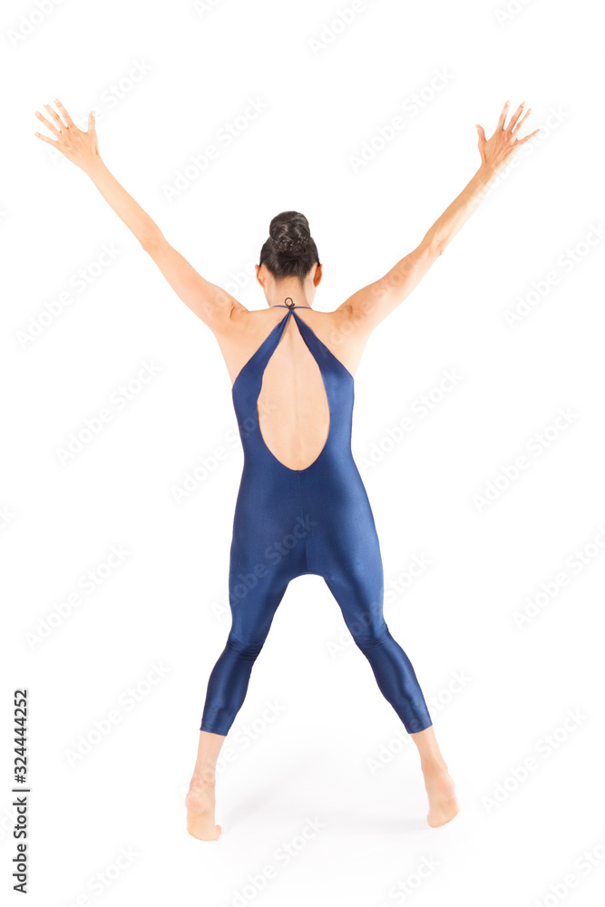 Adult woman dancer in blue bodysuit dancing in the studio. Adult woman dancer in blue bodysuit dancing in the studio.