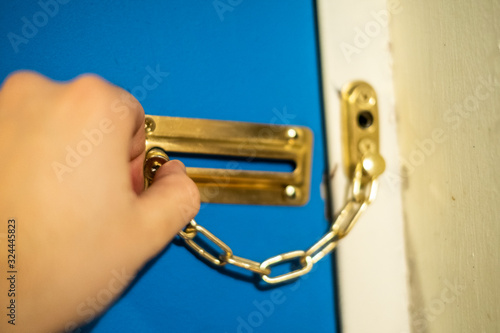 Slika na platnu Person locking door at home