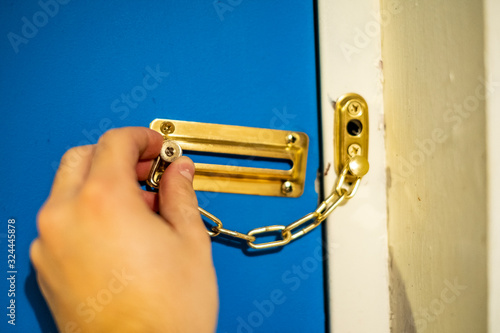 Wall Mural Person locking door at home