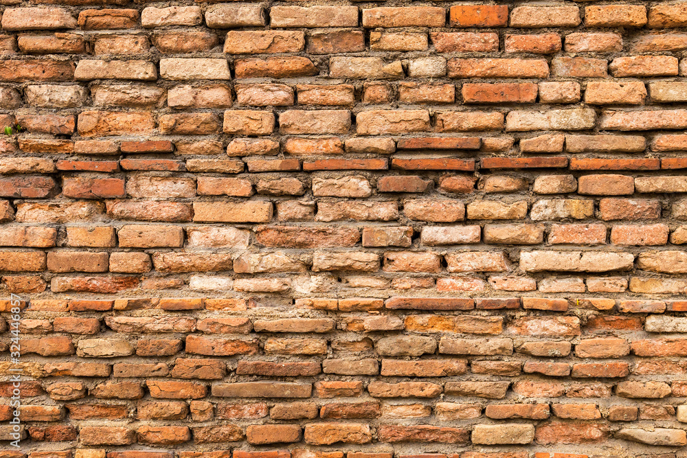 Obraz premium Old brick wall background, old clay brick wall