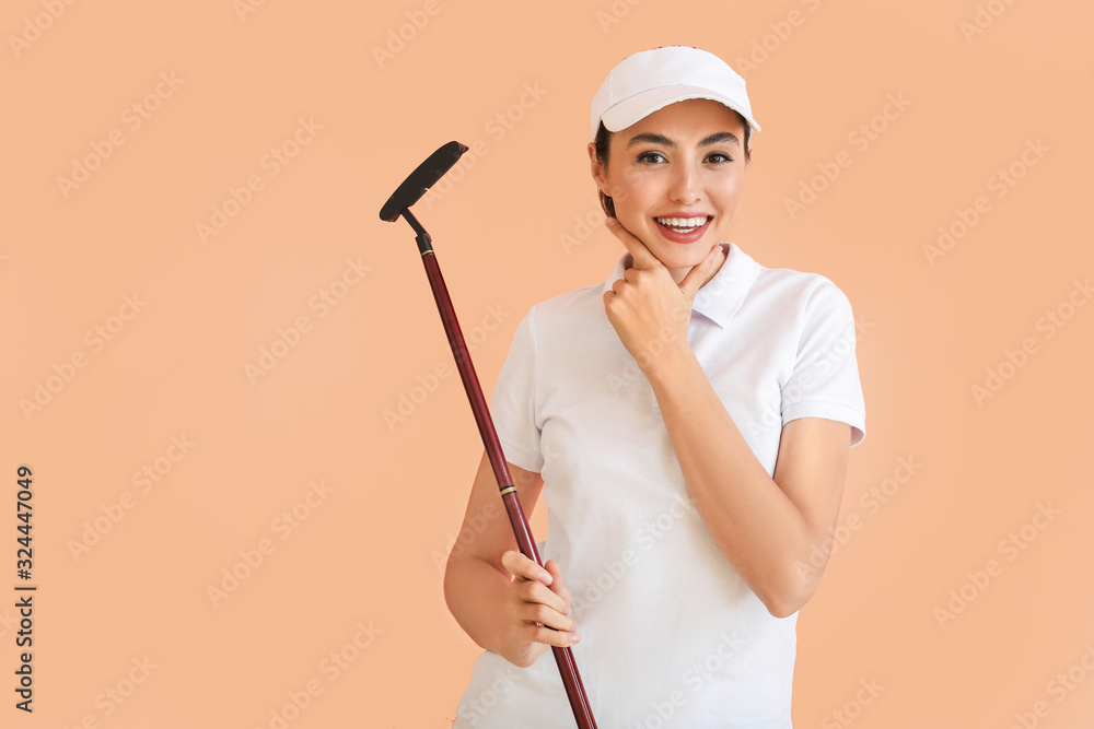 Beautiful female golfer on color background Beautiful female golfer on color background