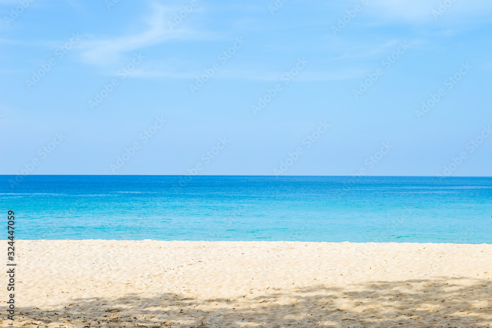 Summer beach, clear white sand and blue sea, nature concept background, relaxing by the beautiful beach, summer outdoor day light, holiday and vacation destination in Southern Thailand, paradise islan
