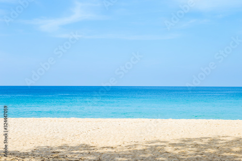 Summer beach, clear white sand and blue sea, nature concept background, relaxing by the beautiful beach, summer outdoor day light, holiday and vacation destination in Southern Thailand, paradise islan