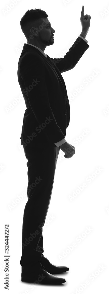 Silhouette of businessman pointing at something on white background. Concept of choice