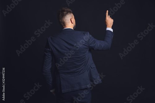 Businessman pointing at som...