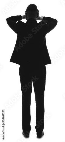 Silhouette of stressed busi...